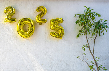 Floating balloons spelling 2025 over a futuristic celebration party, 3D illustration