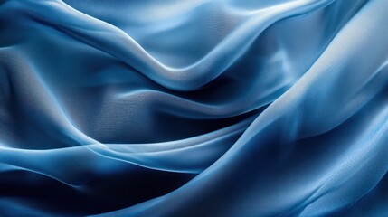 Obraz premium Abstract blue fabric texture with soft waves and folds.