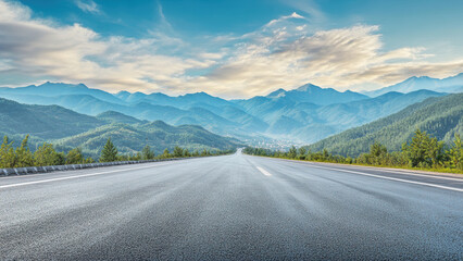 A long, straight road leading towards a mountain range at sunset.