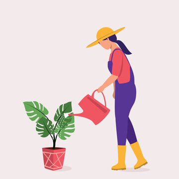Side View Of A Young Woman With Hat And Rubber Boot Pouring Water On The Potted Plant With Watering Can.