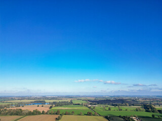 Obraz premium British Agricultural Farms at Gorgeous Countryside Landscape Near Nottingham England Great Britain of United Kingdom. Footage Was Captured with Drone's Camera
