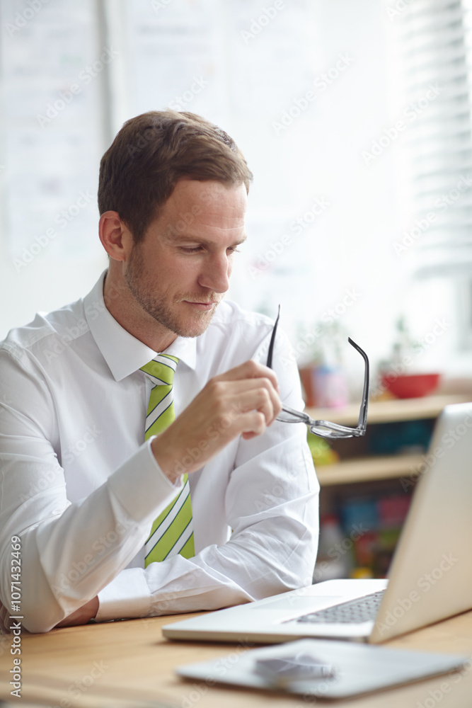 Poster thinking, glasses and businessman on laptop in office for brainstorming, problem solving and solutio