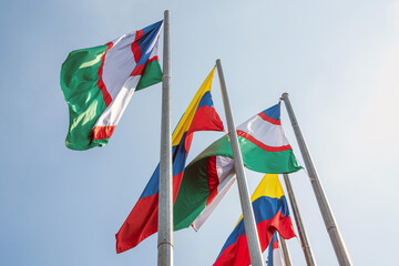 Flags of the city of Santiago de Cali and Colombia, waving on a summer afternoon in the city of Cali