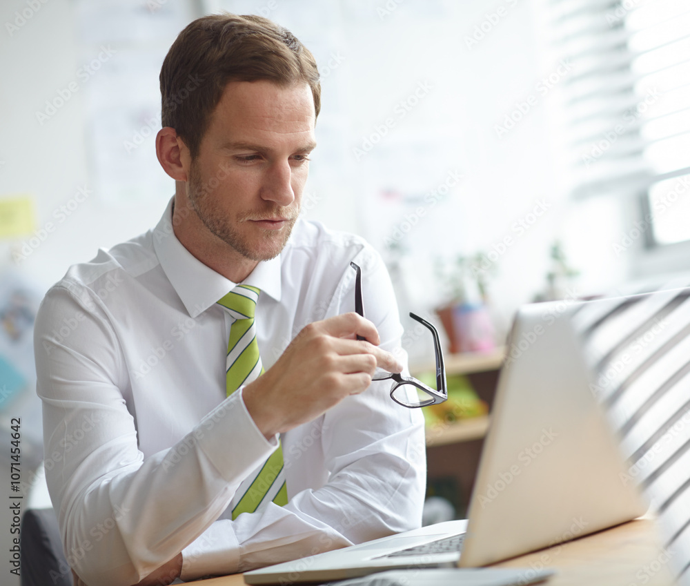 Poster thinking, glasses and business man on laptop in office for brainstorming, problem solving and soluti