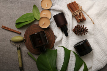 Luxury Skincare Amber Glass Bottles with Natural Elements on Neutral Background

