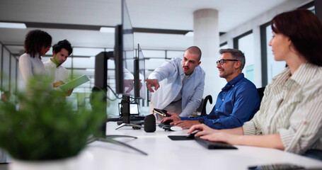 Businesspeople Analyzing Gantt Chart And Calendar On Computer