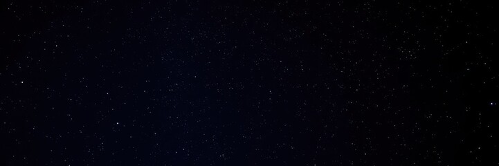 Fototapeta premium Night sky filled with twinkling stars against a dark background, peaceful, sky