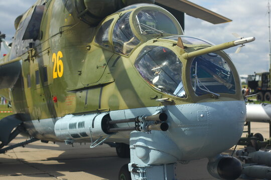 NOVOSIBIRSK - AUG. 26: International military-technical Forum "ARMY-2017" at Novosibirsk Tolmachevo Airport. Mil Mi-24 Russian combat helicopter and fighting set. August 26, 2017 in Novosibirsk Russia