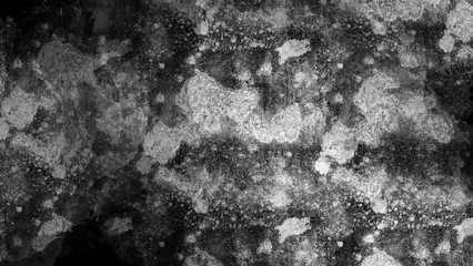 Black and white textured background with splatter.