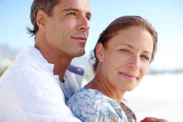 Love, embrace and couple with smile, outdoor and holiday for romance, date and happy in...