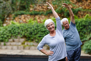 Nature, portrait or old woman in yoga class for stretching arms, balance or inner peace in park....