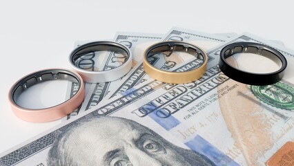 3d rendering of smart rings as wearable electronic device and stack of hundred dollar bills.