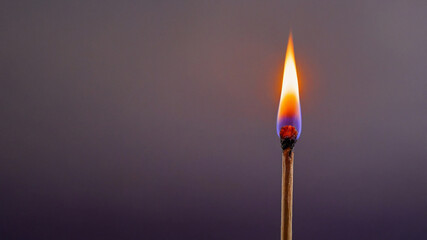 Close-Up of a Lit Matchstick with Vibrant Flame