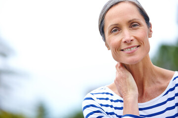 Mature woman, portrait and outdoor on vacation, peace and countryside for happiness in retirement. Female person, confidence and travel to woods to relax, space and holiday in forest of Switzerland