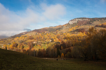 Scenic autumn overview of Magura village in Romania, near the Piatra Craiului mountains