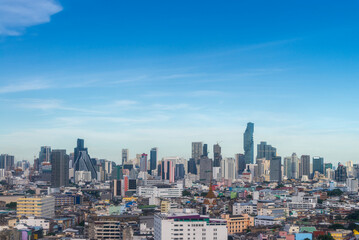Naklejka premium Modern Skyscraper of business center district at Bangkok skyline with blue sky background, Bangkok city is modern metropolis and favorite of tourists of Thailand