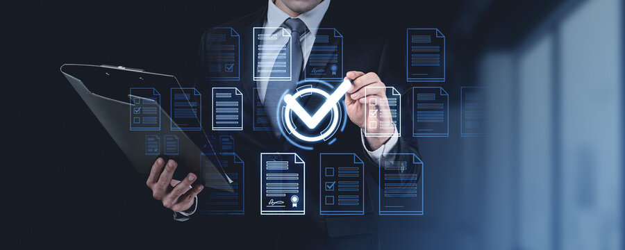 Man in suit holding folder with digital checkmark icons, on dark background. Concept of online document approval and verification