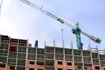 new building.Large construction high rise crane, blue sky
