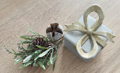 Christmas tree miniature, candle and pine cone on wooden board, mini tabletop decor. Christmas web banner, copy space