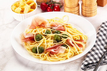Pasta spaghetti with olives and jamon