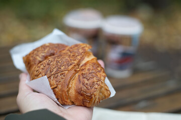 The background is a delicious croissant