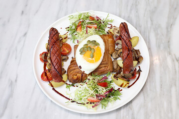 Danish breakfast with egg, sausages and salad