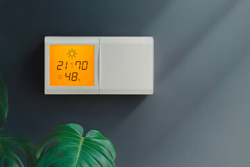 Climate controller. Smart home remote device. Adjust temperature. Appliances connected to home system. Modern home lifestyle