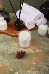 Minimalist White Cosmetic Jar with Spa Accessories and Aromatherapy Decor for Skincare Branding

