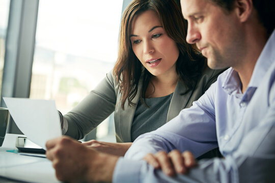 Business, people and meeting with legal document at office for explaining contract with terms and conditions. Corporate, employees and discussion at workplace with paperwork, advice and agreement