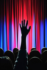 Engaging Audience Hand Raised at Colorful Stage Session