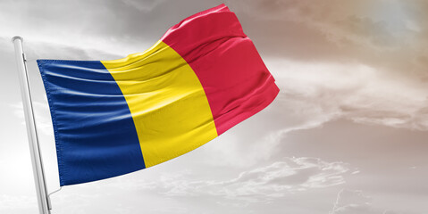 Chadnational flag cloth fabric waving on beautiful grey Background.