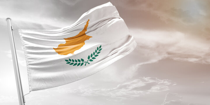 Cyprus national flag cloth fabric waving on beautiful grey Background.