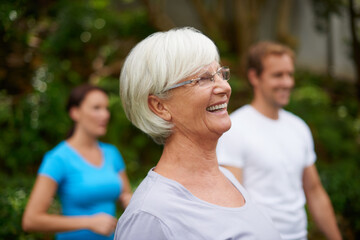 Obraz premium Park, happy senior woman or people in yoga class for wellness, balance or inner peace. Group meditation, smile or funny elderly person laughing in nature for spiritual healing energy or mindfulness