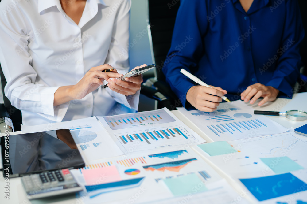 Poster business documents on office table with smart phone and calculator digital tablet and graph business