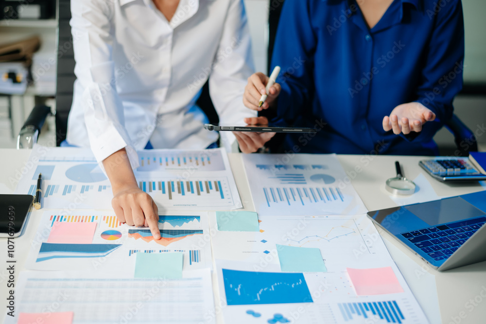 Poster business documents on office table with smart phone and calculator digital tablet and graph business