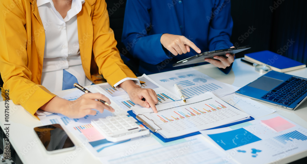 Poster business documents on office table with smart phone and calculator digital tablet and graph business
