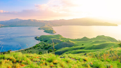 Beautiful and Colorful Sunrise form The Pacific Ocean at Gili Lawa, Komodo National Park, Indonesia. summer background and summer holiday concept.  © Balnyes Visuals