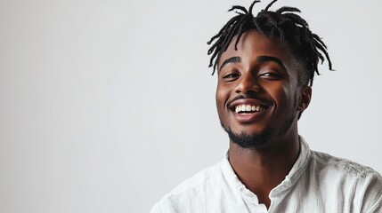 Fototapeta premium Happy Smiling Man with Dreadlocks on Light Background