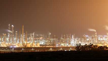 Sasol petrochemical refinery in Secunda, South Africa, at night while the flares burn brightly