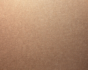 Glossy designer paper background with a rich bronze and copper gradient, featuring a warm, grainy texture with metallic flecks. Elegant and luxurious, Mocha Mousse color of year 2025