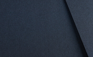 Luxurious designer paper background in dark navy blue with a smooth, satin like finish and cool...