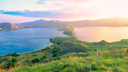 Beautiful and Colorful Sunrise form The Pacific Ocean at Gili Lawa, Komodo National Park, Indonesia. summer background and summer holiday concept.  © Balnyes Visuals
