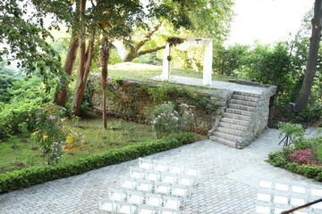Charming Outdoor Wedding Ceremony with Stone Steps and Garden