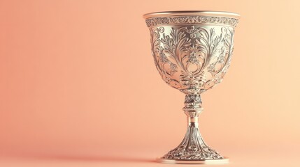 Vintage silver goblet with intricate details, isolated on a pastel peach background for luxury
