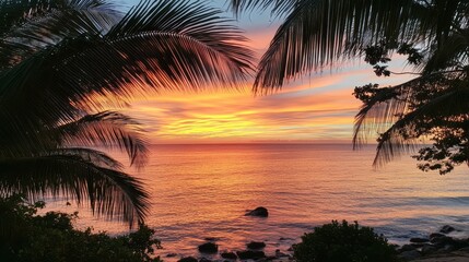 Fototapeta premium Coconut palms frame a perfect sunset view over tranquil waters in gigapixel high fidelity