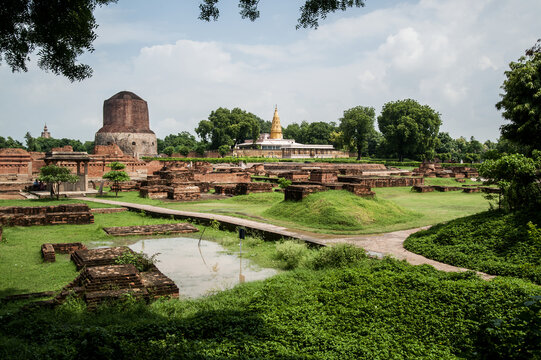 View of the Dhamekh Stupa at the left and the Shri Digambar Jain Temple at the temple of Sarnath 13 kilometres north-east of Varanasi city in India. The temple is an important pilgrimage site.
