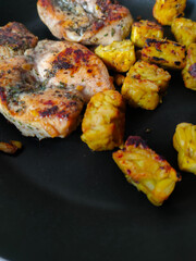 Grilled chicken breast on a grill pan, with tempeh and italian herb.