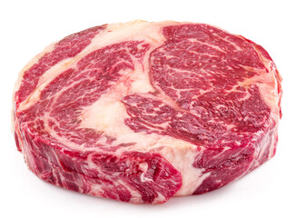Raw ribeye steak isolated on white background.