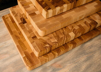 end grain cutting boards lie on the table one on top of the other