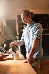 Man, kitchen counter and coffee in home with espresso, mug and hot drink in the morning. Breakfast...